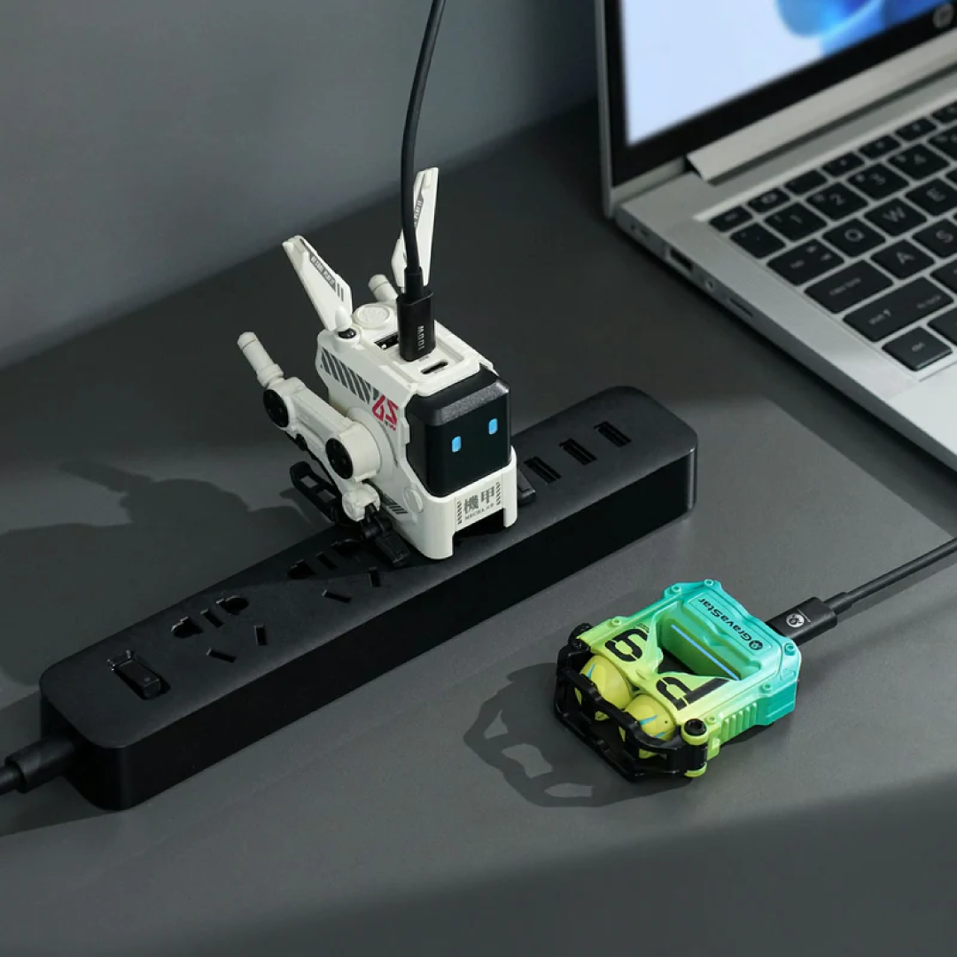 The Alpha65 is a stylish, high-performance GaN (Gallium Nitride) wall charger from GravaStar, designed to combine futuristic aesthetics with practical power delivery. The white (Dawn White) variant gives it a clean, modern appearance that fits well with minimalist or light-themed setups.