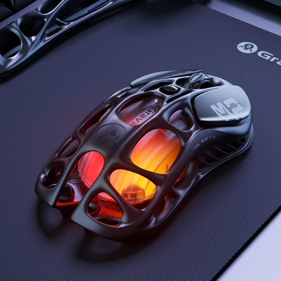 The Mercury M2 Stealth Black is a high-performance gaming mouse designed for gamers seeking precision, versatility, and a sleek aesthetic. Crafted with a hollowed-out structure and a matte black finish, it combines futuristic design with functional ergonomics.